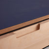 Close-up of a plyzen Corner Doors panel with a precisely cut notch, showcasing the craftsmanship and detail in woodworking.